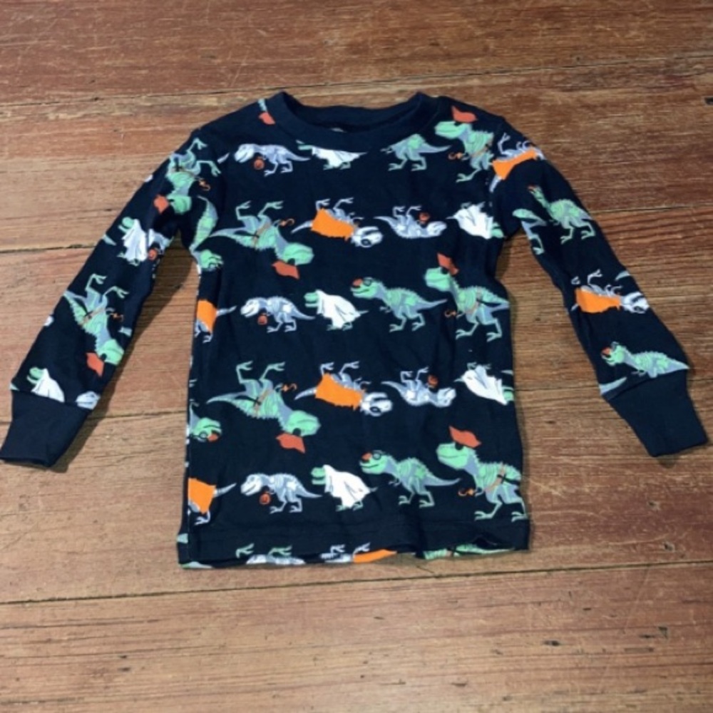 Just one you made by Carter’s. 18M child’s long sleeve shirt with dinosaurs.